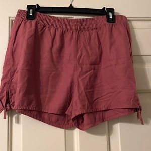 Terracotta colored Madewell shorts with ties on the side